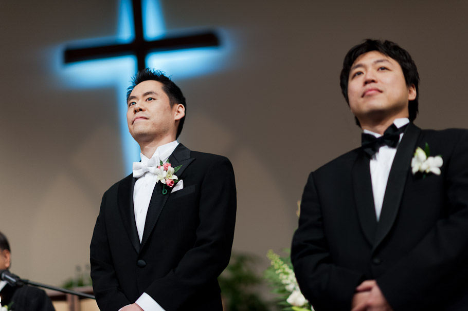 Groom waiting for bride walking down the aisle