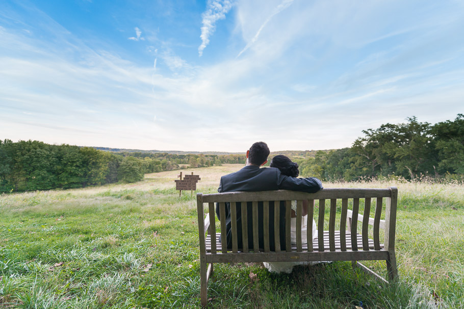 Sachini resting on Mike's shoulder looking out into the meadow
